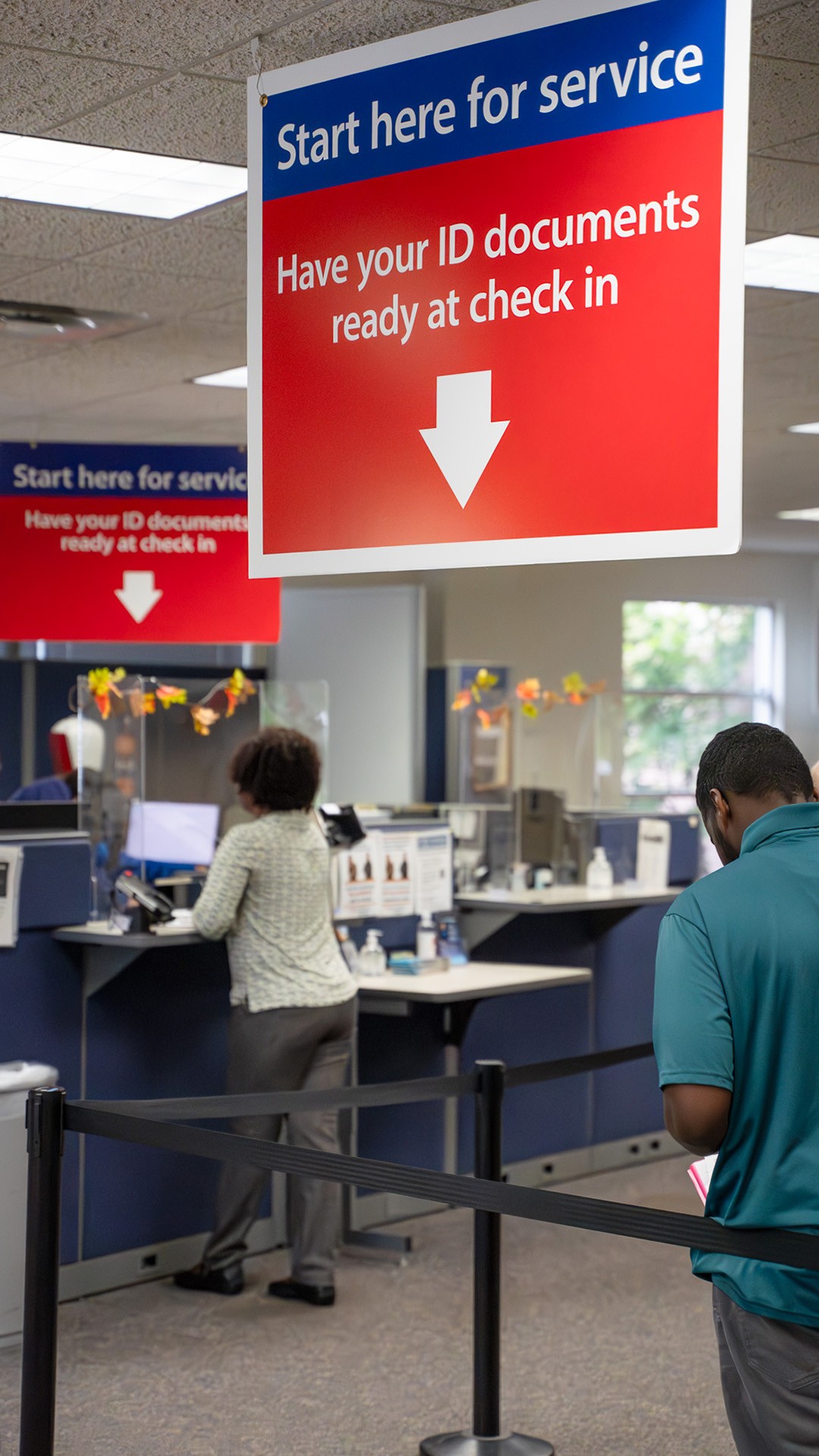 photo of people being assisted at the Wisconsin DMV